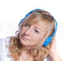 young girl listens to music with headphones isolated on white ba