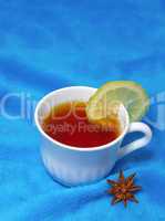 hot tea with lemon on a fur background