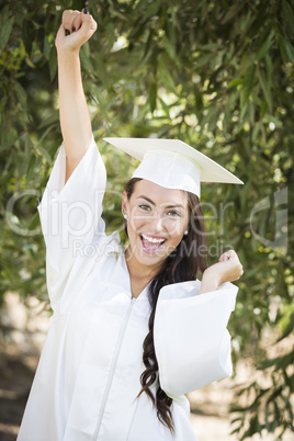 Happy Graduating Mixed Race Girl In Cap and Gown