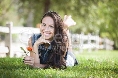 Attractive Mixed Race Girl Portrait Laying in Grass