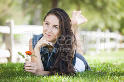 Attractive Mixed Race Girl Portrait Laying in Grass