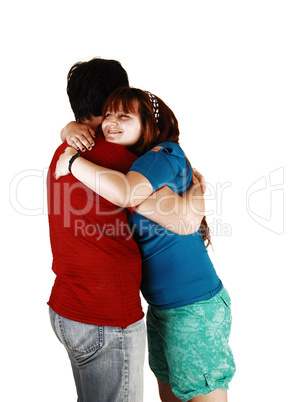 Young couple hugging.