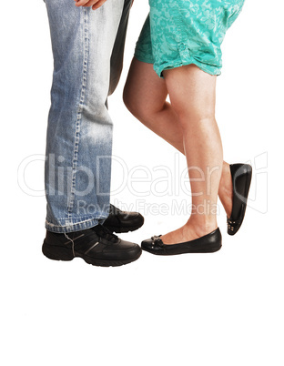 Legs and feet of couple.
