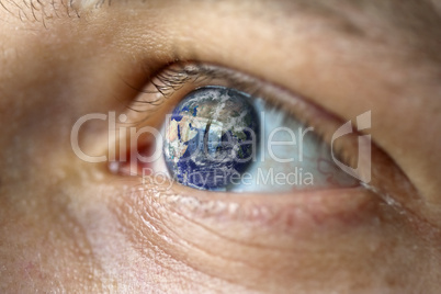 Close-Up of a male face with the earth in the eye