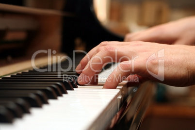 hands of a piano playing guy in a sensitive mood
