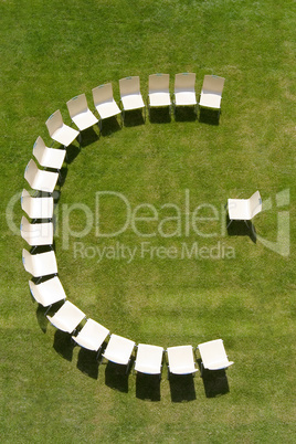 lecture symbolized by chairs arranged in a half circle