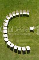lecture symbolized by chairs arranged in a half circle