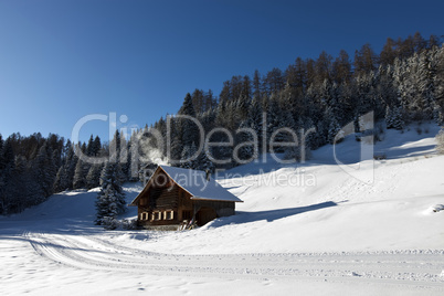 Log cabin in winter