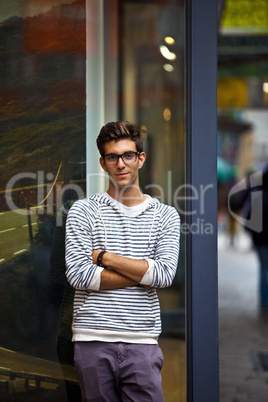 Cool young man in front of urban setting