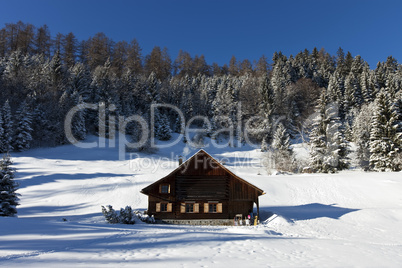 Log cabin in winter