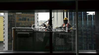 Windows cleaners in a skyscraper
