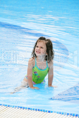 happy girl in the swimming in swimming suit