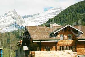 Lovely Swiss chalet with mountains in background