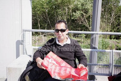 A shot of a handsome caucasian traveling man reading a map