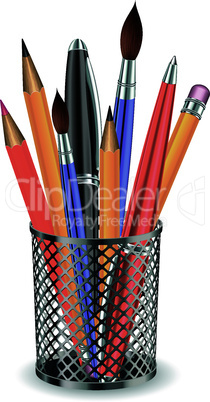 Brushes, pencils and pens in the holder.