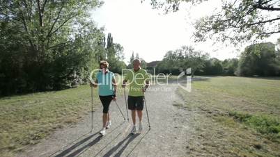 tracking senior nordic walking couple