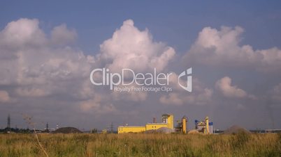 clouds over small factory, timelapse