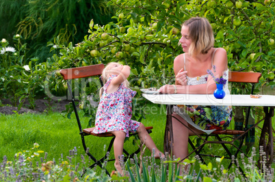 mother and daughter in the garden