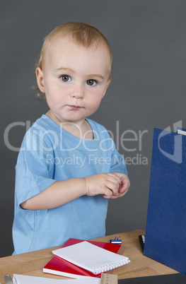 young child at small desk