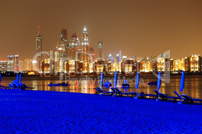 Night illumination of the luxury hotel beach on Palm Jumeirah ma