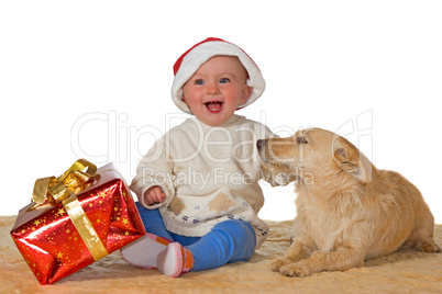 Merry baby enjoying Christmas with dog