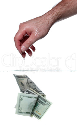 hand and dollar banknotes in water