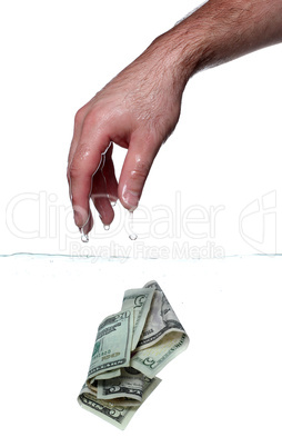 hand and dollar notes in water