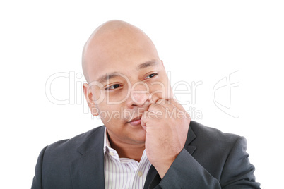 Portrait of a young business man looking away and thinking