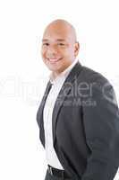 Happy businessman standing with hands in pocket, looking at came