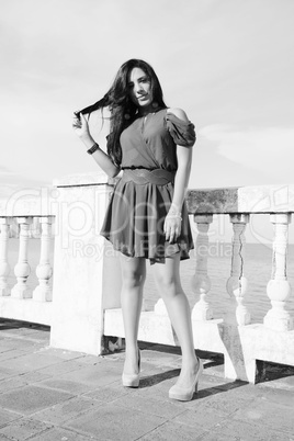 Young woman standing. Black and white concept.