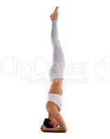athletic woman yoga coach stand on head isolated