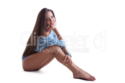 sexy pretty girl sit in stripped cloth isolated