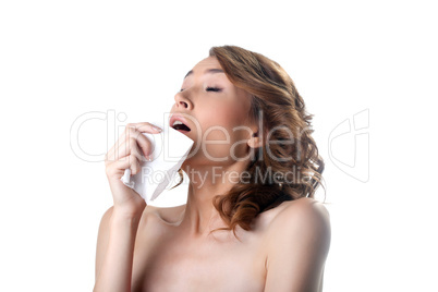 Young pretty sick woman sneezing on kerchief