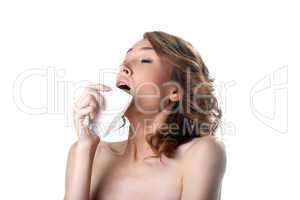 Young pretty sick woman sneezing on kerchief