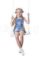 Happy girl sitting on swing