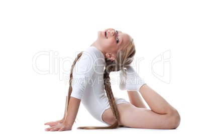 Pretty girl performing gymnastic exercises