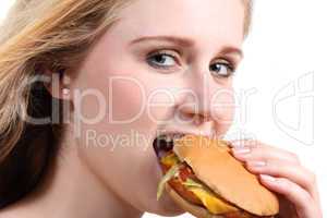 Young woman eating vegetarian burger