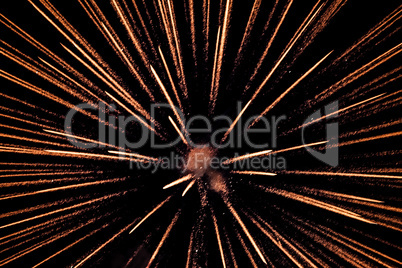 Exploding pyrotechnic firework sparks on night sky