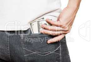 Dollar currency in jeans pocket