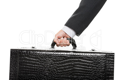 Hand holding suitcase