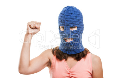 Woman in balaclava showingraised fist gesture