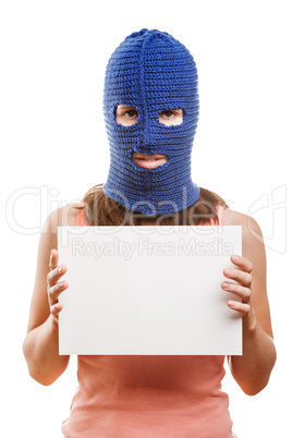 Woman in balaclava holding blank card