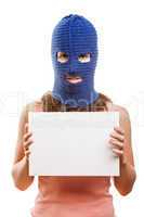 Woman in balaclava holding blank card