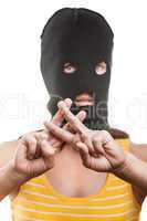 Woman in balaclava showing jail or prison finger gesture