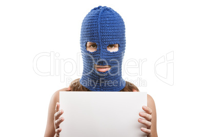 Woman in balaclava holding blank card