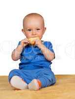 Adorable baby eating a bun