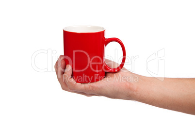 Male hand is holding a red cup