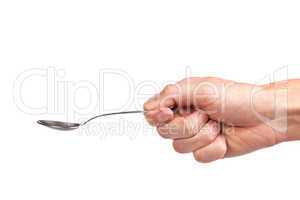 Hand is holding a spoon isolated