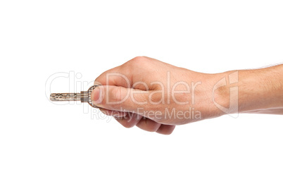 Male hand holding a key to the house