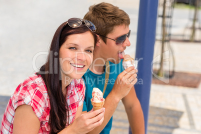 Young woman and man eat ice cream